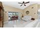 Living Room with vaulted ceiling, white sofas, and access to patio and canal at 840 Via Tunis, Punta Gorda, FL 33950