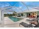 Inviting screened pool with patio and lounge chairs at 840 Via Tunis, Punta Gorda, FL 33950