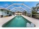 Relaxing screened pool with patio and lounge chairs at 840 Via Tunis, Punta Gorda, FL 33950