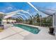 Spacious screened pool with patio and lounge chairs at 840 Via Tunis, Punta Gorda, FL 33950