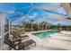 Relaxing screened pool area with lounge chairs at 840 Via Tunis, Punta Gorda, FL 33950