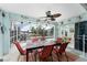 Sunroom with table, chairs, and view of pool and canal at 840 Via Tunis, Punta Gorda, FL 33950