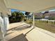 Covered patio with concrete flooring and potted plants at 8541 Regency Ct, North Port, FL 34287