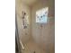 Clean shower stall with tiled walls and a shower head at 8541 Regency Ct, North Port, FL 34287