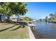 Relaxing waterfront view with a private dock and lush greenery at 88 Sabal Dr, Punta Gorda, FL 33950