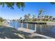 Private dock and lush landscaping along a tranquil waterway at 88 Sabal Dr, Punta Gorda, FL 33950