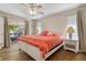 Peaceful main bedroom with water views and coral bedding at 88 Sabal Dr, Punta Gorda, FL 33950