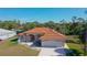 One-story house with terracotta tile roof, and a large yard at 108 Mccabe St, Port Charlotte, FL 33953