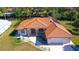 Single-story home with tile roof, fountain, and two-car garage at 108 Mccabe St, Port Charlotte, FL 33953