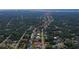 Aerial view of canal-front home with private dock and lush landscaping at 108 Mccabe St, Port Charlotte, FL 33953