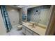 Clean bathroom with a tub, toilet and vanity at 108 Mccabe St, Port Charlotte, FL 33953