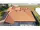 Aerial view of the home showcasing a large terracotta tile roof at 108 Mccabe St, Port Charlotte, FL 33953