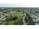 Aerial view of residential neighborhood with golf course at 102 Annapolis Ln, Rotonda West, FL 33947