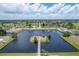 Aerial view of waterfront property with private docks at 102 Annapolis Ln, Rotonda West, FL 33947