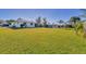 Large backyard with grassy area and canal view at 102 Annapolis Ln, Rotonda West, FL 33947