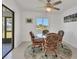 Bright dining area with glass table and wicker chairs at 102 Annapolis Ln, Rotonda West, FL 33947