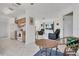 Kitchen with white appliances and wood cabinets, open to adjacent living area at 102 Annapolis Ln, Rotonda West, FL 33947