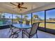 Enjoy dining in this screened patio with water views at 102 Annapolis Ln, Rotonda West, FL 33947