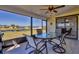 Relaxing screened patio with table and chairs, overlooking the canal at 102 Annapolis Ln, Rotonda West, FL 33947