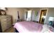 Bedroom with a full-size bed and dresser at 10454 Waterford Ave, Englewood, FL 34224