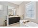 Spa-like bathroom featuring a soaking tub and modern vanity at 10628 Nicklaus Ct, Englewood, FL 34223