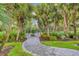 Dog park with paved path and landscaping at 10628 Nicklaus Ct, Englewood, FL 34223