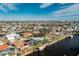 Aerial view of a canal-front community with numerous houses and boats at 115 Sw Seville Sw Pl, Port Charlotte, FL 33952