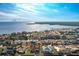 Bird's-eye view showcasing a single-Gathering home's location in a waterfront community at 115 Sw Seville Sw Pl, Port Charlotte, FL 33952