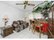 Small bar area with red counter, wooden stools and display cabinet at 115 Sw Seville Sw Pl, Port Charlotte, FL 33952