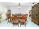 Formal dining room with wood table and chairs, plus a china cabinet at 115 Sw Seville Sw Pl, Port Charlotte, FL 33952