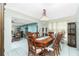 Bright dining room featuring a wood table and chandelier at 115 Sw Seville Sw Pl, Port Charlotte, FL 33952