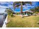 Single story home with lush landscaping and waterfront access at 115 Sw Seville Sw Pl, Port Charlotte, FL 33952