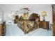 Main bedroom with a large bed and access to the outside at 115 Sw Seville Sw Pl, Port Charlotte, FL 33952