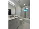 Modern bathroom with marble floors and shower/tub combo at 12547 Trinity Ave, Port Charlotte, FL 33953