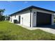 Side view of house, showing garage and AC unit at 12547 Trinity Ave, Port Charlotte, FL 33953