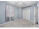 Cozy bedroom with ceiling fan, window, and closet at 1259 Jonah Dr, North Port, FL 34289