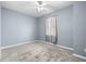 Well-lit bedroom with carpet, window, and ceiling fan at 1259 Jonah Dr, North Port, FL 34289