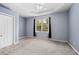 Bright bedroom featuring a window with natural light and ceiling fan at 1259 Jonah Dr, North Port, FL 34289