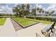 Bocce ball court with benches, providing a relaxing outdoor game option at 1259 Jonah Dr, North Port, FL 34289