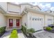 Front view of townhome with double doors and garage at 1259 Jonah Dr, North Port, FL 34289