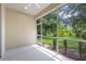 Peaceful screened porch overlooking a lush green backyard at 1259 Jonah Dr, North Port, FL 34289