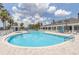 Resort-style swimming pool with plenty of lounge chairs at 1259 Jonah Dr, North Port, FL 34289