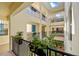 Bright condo interior hallway with skylights and lush plants at 1340 Rock Dove Ct # 134, Punta Gorda, FL 33950