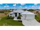 Modern single-Gathering home with a metal roof and two-car garage at 1380 Willet Ct, Punta Gorda, FL 33950