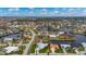 Aerial view of house and neighborhood, highlighting waterfront access at 1380 Willet Ct, Punta Gorda, FL 33950