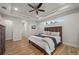 Main bedroom with king-size bed, wood dresser and access to the bathroom at 1380 Willet Ct, Punta Gorda, FL 33950