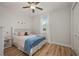 Bedroom with a queen-size bed and wood floors at 1380 Willet Ct, Punta Gorda, FL 33950