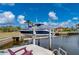 Boat lift at a private dock, ideal for water access at 1380 Willet Ct, Punta Gorda, FL 33950