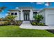 Home with walkway and landscaping at 1380 Willet Ct, Punta Gorda, FL 33950