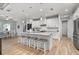 Spacious kitchen featuring white cabinets, granite countertops, and an island at 1380 Willet Ct, Punta Gorda, FL 33950